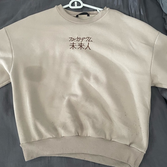 Nice sweater with Japanese writing on it. Does have a few noticeable stains - Picture 1 of 1